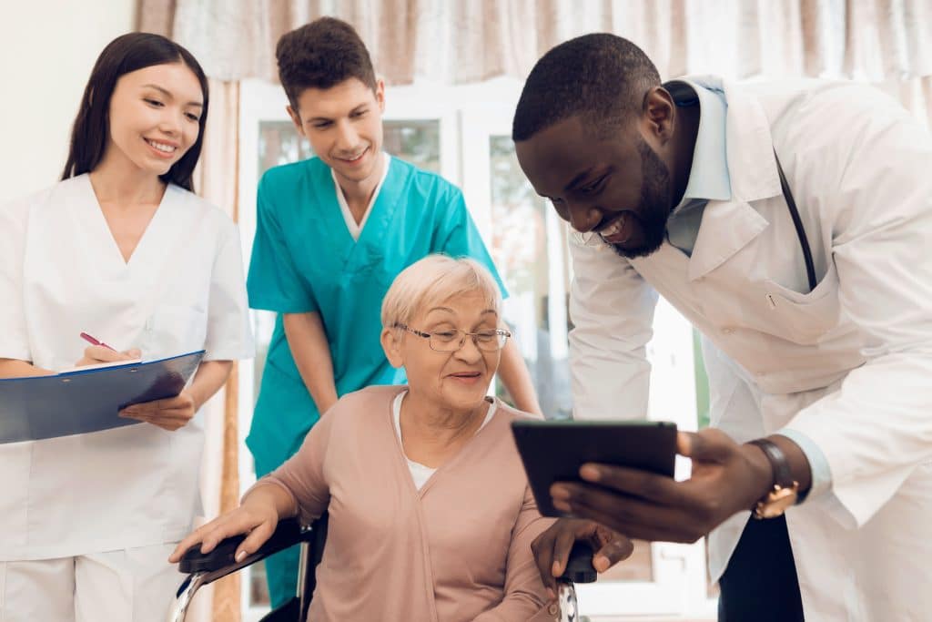 Medical Assistants at work gaining direct patient care experience stock photo