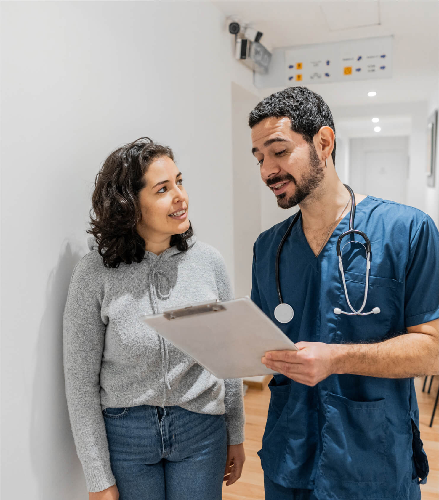 Male nursing discussing medical exam with pateint