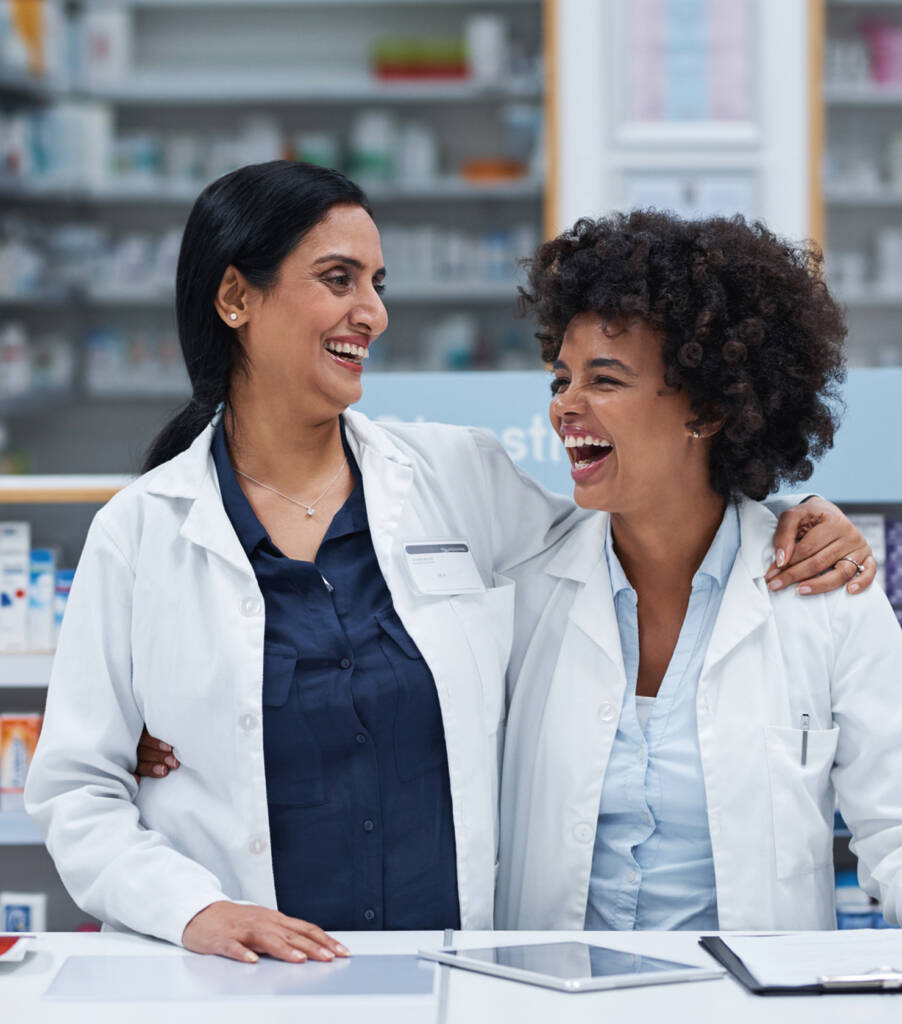 Pharmacist mentor and medical student laughing together