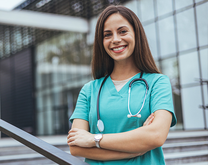 portrait of ACT grad student outside of a hospital