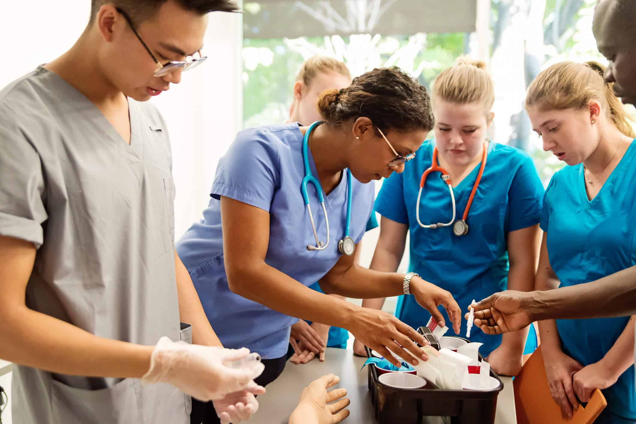group of students looking at medical supplies